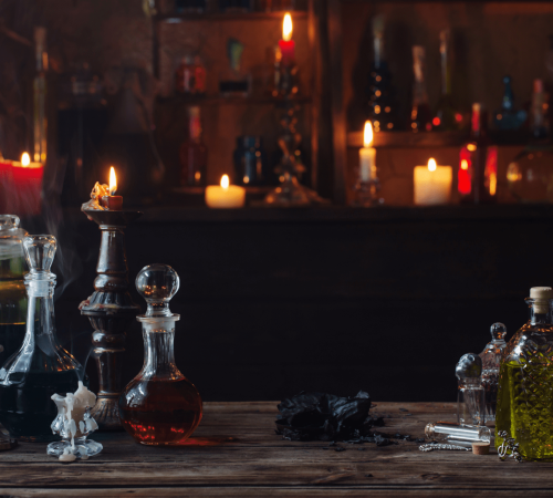 Dimly lit room with candles and alchemy potions